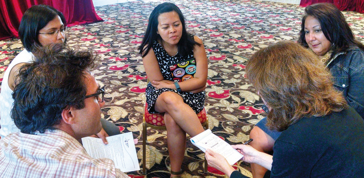 Mennonite Church USA Executive Board members, clockwise from upper left, Nisha Subaiya Springer of Plano, Texas; Joyce Kusuma of Upland, Calif.; Yvonne Diaz of Terlingua, Texas; Michelle Dula of Lancaster, Pa.; and Isaac Villegas of Durham, N.C., confer during the board’s Sept. 17-19 meeting in Kansas City, Mo. — Mennonite Church USA