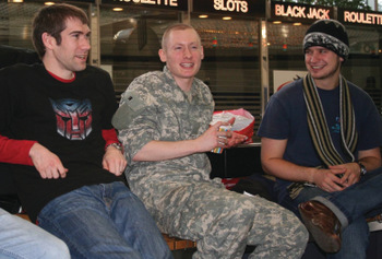 Tim Huber, Robert Weiss and Michael J. Sharp talk in 2008 in Frankfurt Airport. Weiss had just been released from military confinement after pleading guilty to charges of desertion and missing movement after his application for conscientious objector status was denied. Weiss spent the end of 2007 and beginning of 2008 living in Goshen, Ind., speaking to Mennonite church groups about his experiences in the military. — Tim Huber