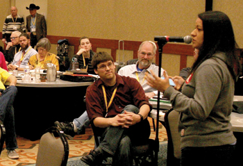 Joanna Chapa of Rio Grande City, Texas, who serves in Peru with Multiply, the Mennonite Brethren mission agency, speaks during discussion time at the USMB study conference on "The Bible and Women in Pastoral Ministry." — Paul Schrag/MWR