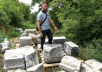 Max Shtatsky looks over Mennonite gravestones recovered from a barn’s foundation in Chortitza, Ukraine. The stones have been transported to Khortitsa National Nature Reserve in Zaporizhzhia, where they will become a Mennonite memorial. — Max Shtatsky