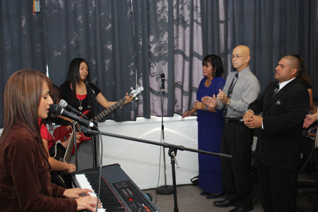 From left, the music-worship team and Esther and José during worship at the House of Healing Mennonite Church in Dallas. Photo by Everett J. Thomas