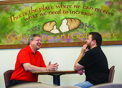 David B. Miller, associate professor of missional leadership development and AMBS-SCUPE program liaison, meets with advisee Martin Navarro.  Photo provided by     AMBS.