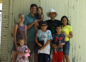 The Roth and King families with chickens. 