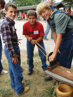 The Junior Historians (a youth volunteer program ages 10-16) make rope at Sauder Village, Ohio’s largest living-history destination. Photo provided by Sauder Village