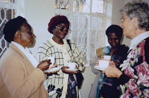Sara having tea with women in Mozambique. Photo provided.